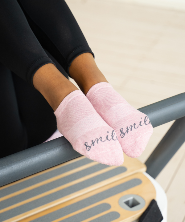 Close-up of Smile Pink Marle low rise grip socks with reinforced stitching