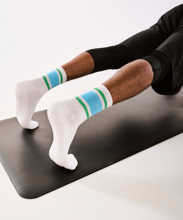Men's crew non slip grip socks in a stylish Nordic stripe pattern, perfect for keeping your feet warm and secure during winter activities